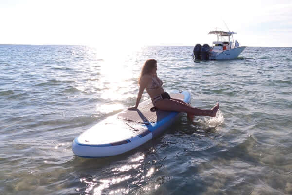 Photo of woman on paddle board relaxing in the Florida Keys